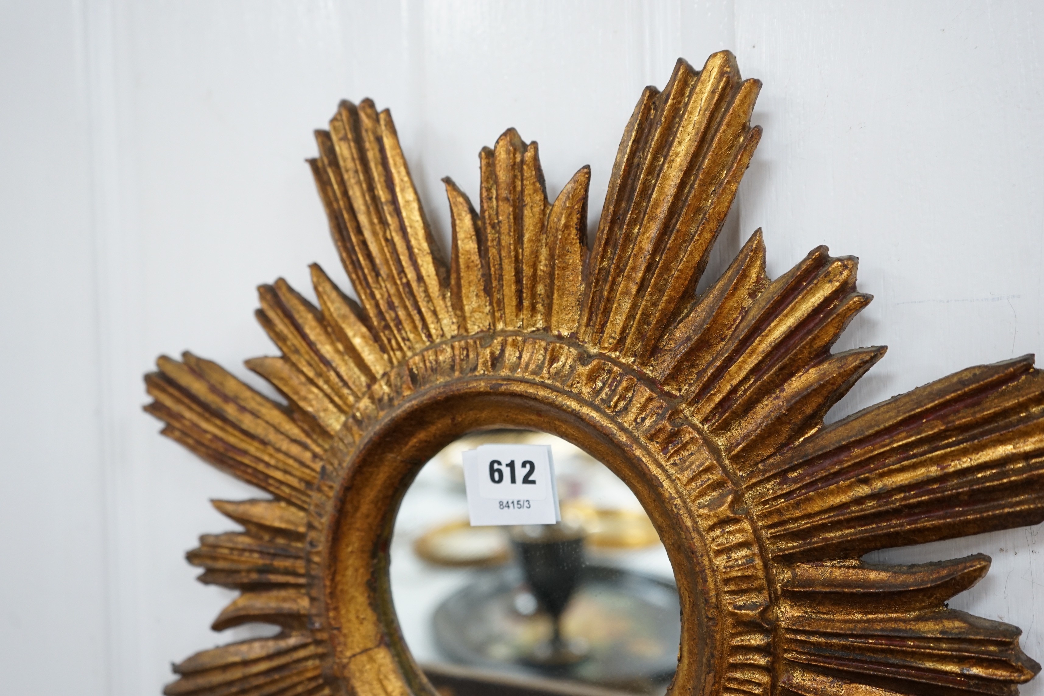 A gilt star-burst wall mirror, 47cm